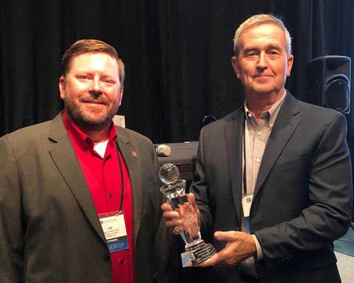 Dr. Jim Kerns, left, presented the Distinguished Service Award to NC State colleague, Dr. Rick Brandenburg.